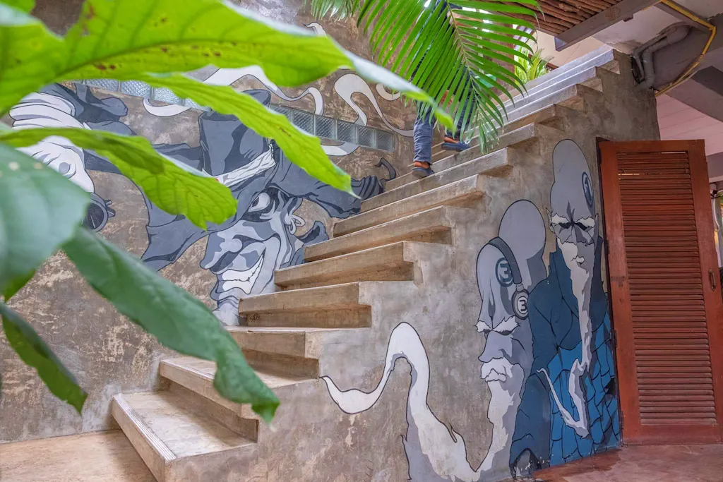 Artistic stairway at Happy House hostel Pai