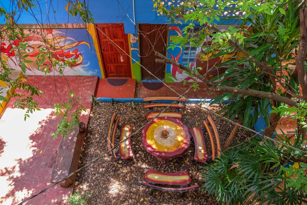Outdoor seating area at Happy House hostel Pai