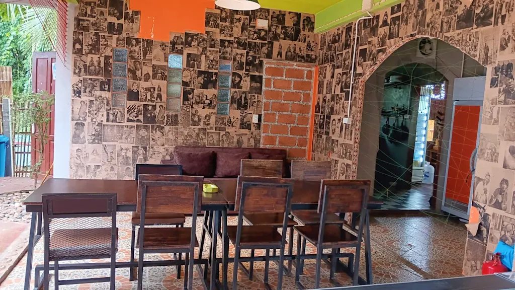 Communal dining area at Happy House hostel Pai